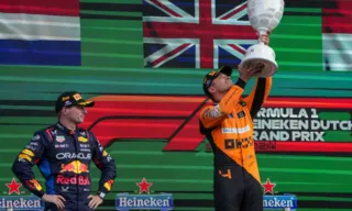 Imagem ilustrativa da imagem Norris comemora vitória no GP da Holanda usando bordão de Verstappen