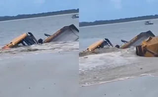 Imagem ilustrativa da imagem Vídeo: areia ‘engole’ máquina durante obras de alargamento de praia em SC