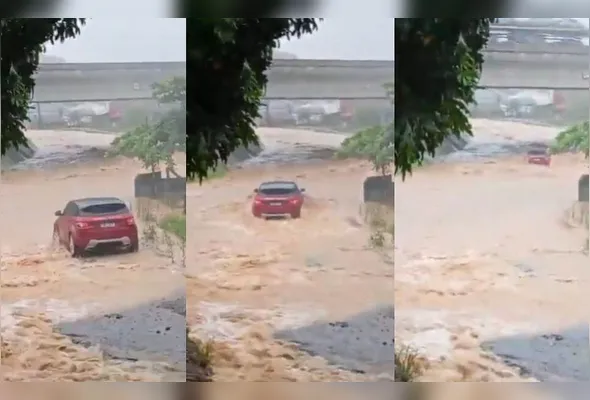 O veículo, uma Land Rover, estava trancado sob a ponte, pressionado pela correnteza e com as rodas viradas para cima.