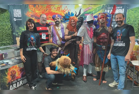 Marcelo Herzog (1º à direita) com equipe da Mito Games no estande do jogo “Tupi” na feira BGS 2025