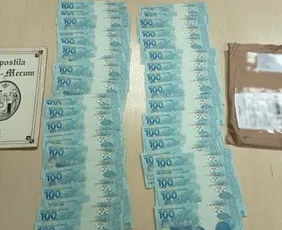 Imagem ilustrativa da imagem Mulher é presa recebendo encomenda de notas falsas em Cariacica