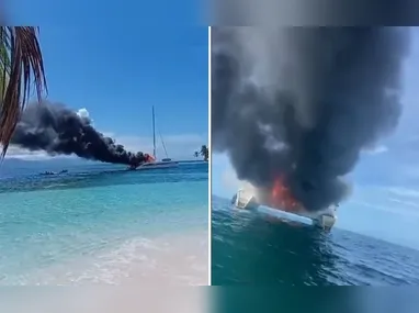 Imagem ilustrativa da imagem Brasileiros saltam em mar com tubarões após barco no Panamá pegar fogo