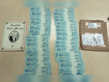 Imagem ilustrativa da imagem Mulher é presa recebendo encomenda de notas falsas em Cariacica