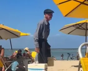 Imagem ilustrativa da imagem Idoso de 85 anos que vende pudim em praia recebe onda de apoio