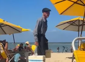 Imagem ilustrativa da imagem Idoso de 85 anos que vende pudim em praia recebe onda de apoio