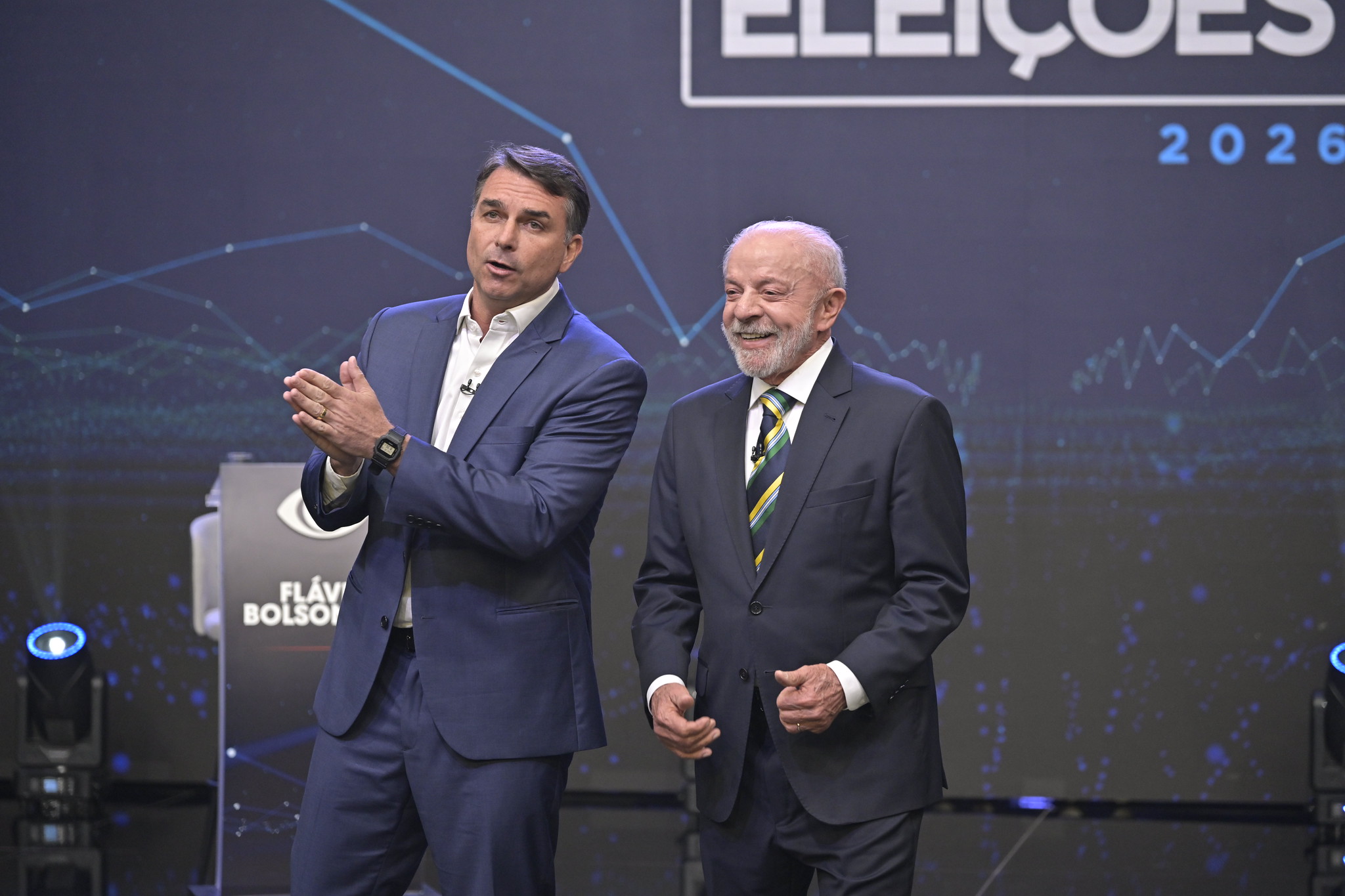 Flávio Bolsonaro e Lula durante debate promovido pela Band