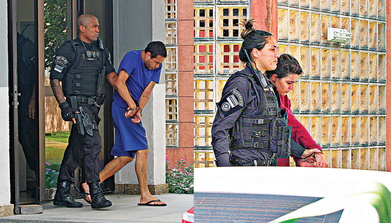 Georgeval Alves e a mulher Juliana Sales são conduzidos por agentes penitenciários em audiência no fórum de Linhares. O casal é julgado pelas mortes dos filhos Joaquim Alves Sales e Kauã Sales Butkovsky (Foto: Leone Iglesias/AT)