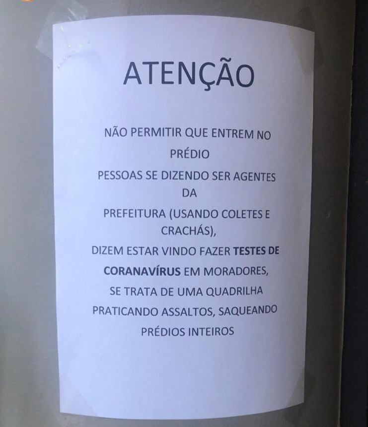 Aviso fixado em prédio com alerta (Foto: Divulgação WhatsApp)