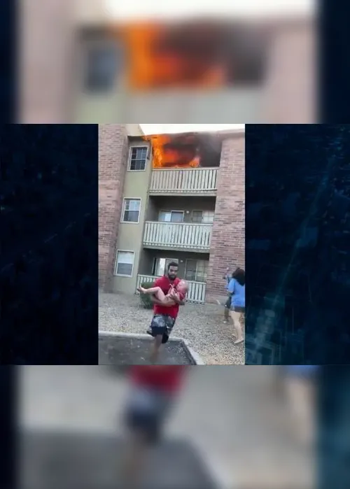Imagem ilustrativa da imagem VÍDEO | Ex-jogador de futebol salva criança que foi jogada de casa em chamas