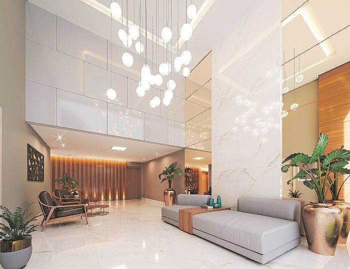 Lobby luxuoso na entrada do edifício, com sofá e poltronas para espera (Foto: Divulgação)