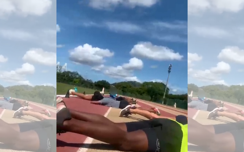 Atletas se jogaram no chão, na pista de atletismo, para não serem baleados (Foto: Reprodução/Vídeo)